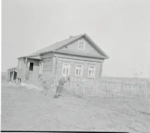 Woman Collecting Hay
