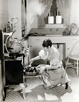 Stove Prints: Woman Cooking In Kitchen At Stove