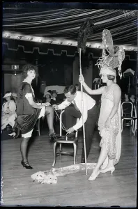 Audition Prints: Woman In Costume, Man Measures Other's Leg