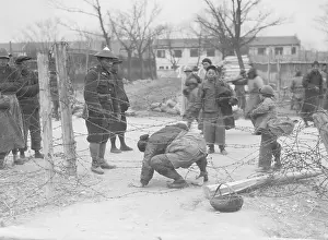 Woman Crawling Through Barbed Wire