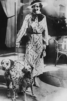 Two Animals Gallery: Woman with two dalmatians wearing patterned dress (B&W)