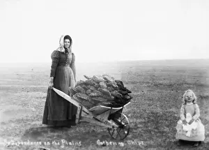 Frontiers Prints: Woman and Daughter Gathering Buffalo Chips