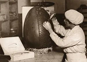 Toned Image Prints: Woman Decorating Fifteen Pound Chocolate Easter egg (B&W sepia)