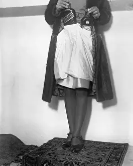 Hiding Prints: Woman Demonstrating Alcohol Smuggling