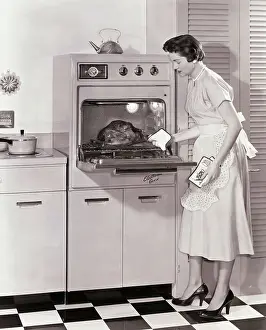 Convenience Prints: Woman Demonstrating Modern Oven for Cooking