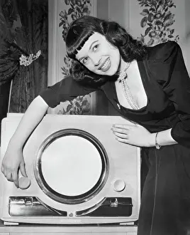 Turning Prints: Woman Demonstrating New Television