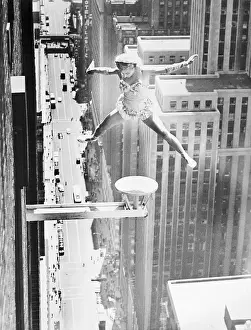 Balancing Prints: Woman Doing Stunts On Building