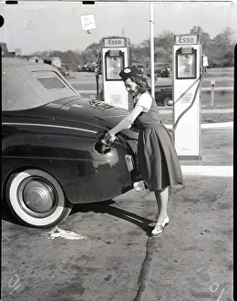Gas Station Prints: Woman In Dress Dispenses Gas