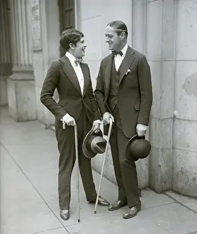 Cross Dresser Prints: Woman Dressed Like Man Talks To Man