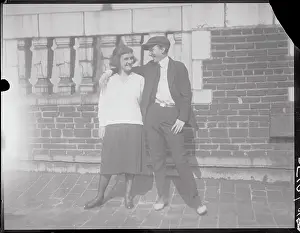 Woman Dressed as Man Embracing Another Woman