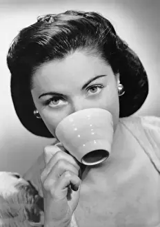 Woman drinking from cup
