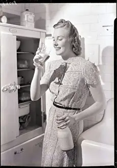 Juice Prints: Woman Drinking Milk Next to the Refrigerator
