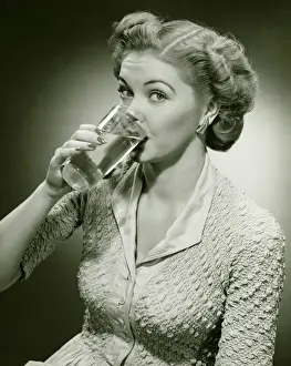 Neat Prints: Woman drinking water from tall glass, (B&W), (Close-up), (Portrait)