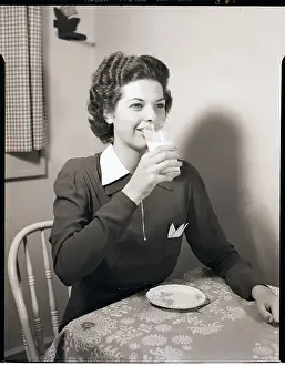 Milk Prints: Woman Drinks Milk from Glass at Table