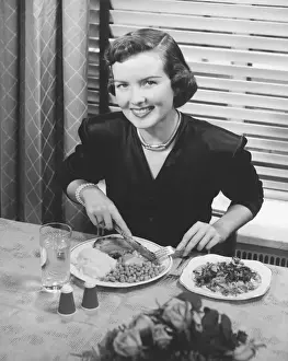Black Colour Prints: Woman eating dinner (B&W), elevated view