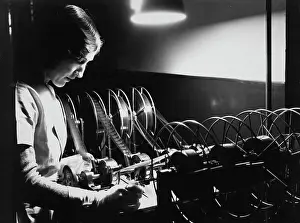 Huty36284 Prints: Woman Editing Film