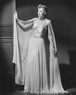 Images Dated 10th October 2006: Woman in evening gown posing in studio (B&W), portrait