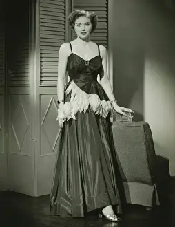 Silk Prints: Woman in fashionable evening gown posing at home, (B&W), portrait