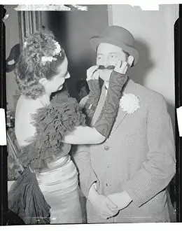 Woman Fixing Her Husband's Mustache