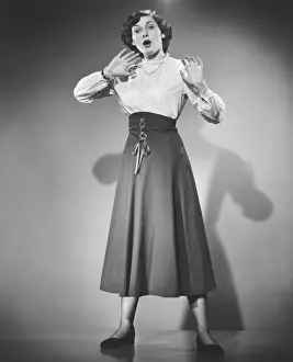 Open Mouth Prints: Woman gesturing in studio, (B&W), portrait