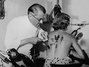 Woman Getting Tattooed