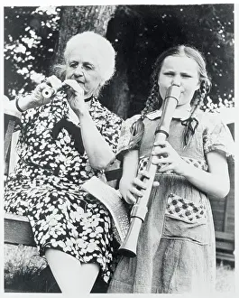 Woman and Girl Playing Recorders