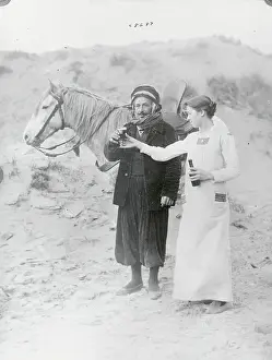 Woman Giving Soldier Drink