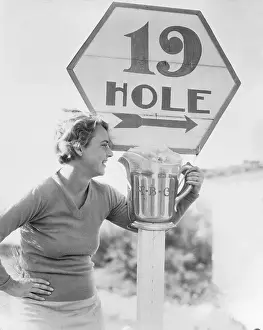 Woman Grabbing Amusing Sign