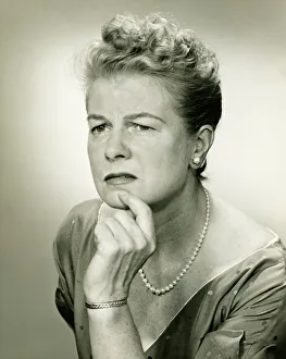 Pearl Collection: Woman with hand on chin, (B&W), portrait