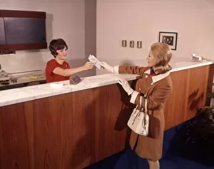 Bank Gallery: Woman Handing Deposit To Bank Teller Banking Women