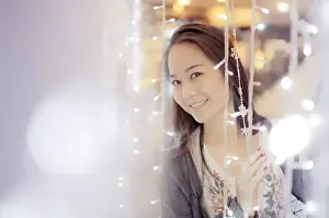 Woman hiding behind light curtain