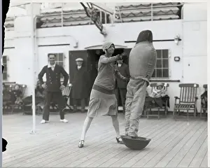 Dummy Prints: Woman Hits Dummy Figure on Ship Deck
