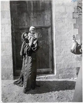 Muslim Prints: Woman Holding up Her Child on Street