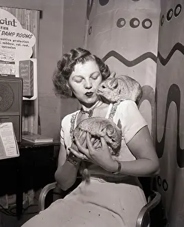 Woman Holding Two Chinchillas