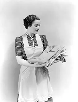 Chores Prints: Woman Holding Clean Laundry Shirts Wearing Polka Dot Dress And Apron Pride Housewife