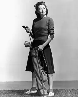 Sweater Prints: Woman Holding Golf Club And Golf Bag