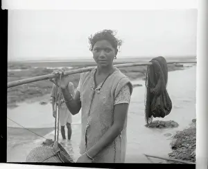 Woman Holding a Pole
