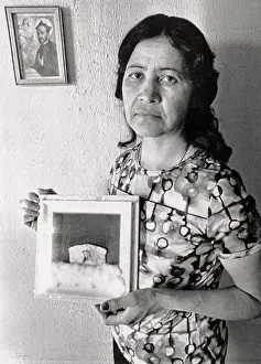 Woman Holding Portrait
