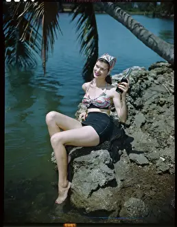 Woman Holding a Soda Bottle