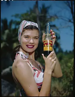 Soft Drink Prints: Woman Holding a Soda Bottle
