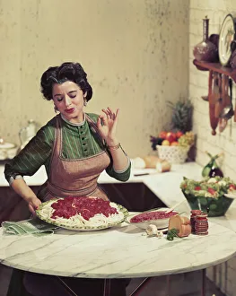 Casual Collection: Woman holding tray of noodles and gesturing