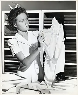 Nightgown Prints: Woman Holds Up Nightgown While Shopping