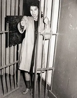 Screaming Prints: Woman in Jail Cell Pointing and Yelling