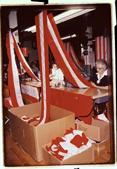 Woman Joining Red and White Stripes of Cloth