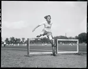 Woman Jumping Hurdle