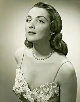 Society Beauty Prints: Woman in lace evening gown posing in studio, (B&W), portrait