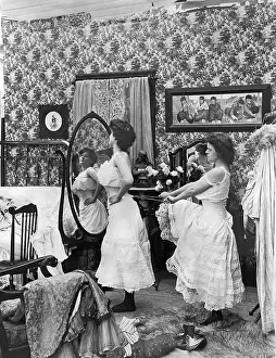 Teamwork Prints: Woman Lacing Up Woman's Corset