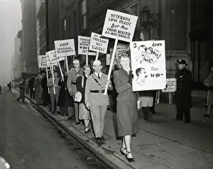 Woman Leads Anti-Communist Picket Line