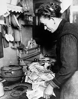 Woman Lighting Fire with German Money