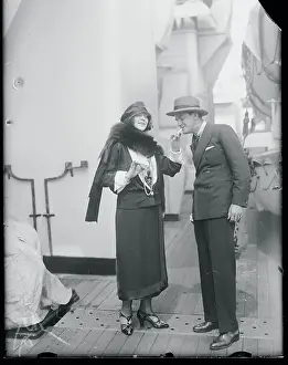 Woman Lighting Man's Cigarette